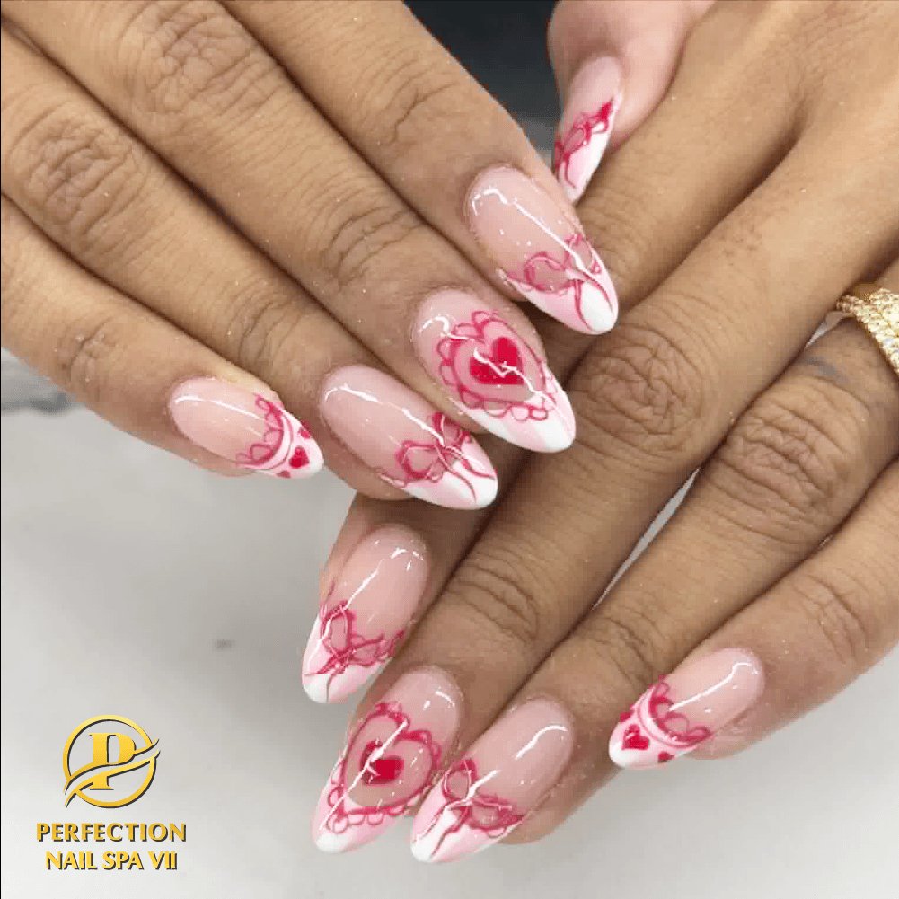 Red heart Valentine nail design on almond nails